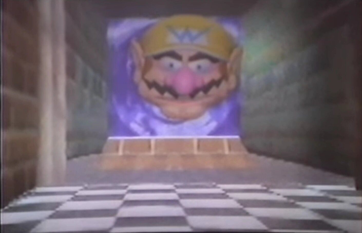 a large wario head floating in a hallway